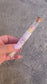 Matches with pink tips, in a clear tube with a wooden lid